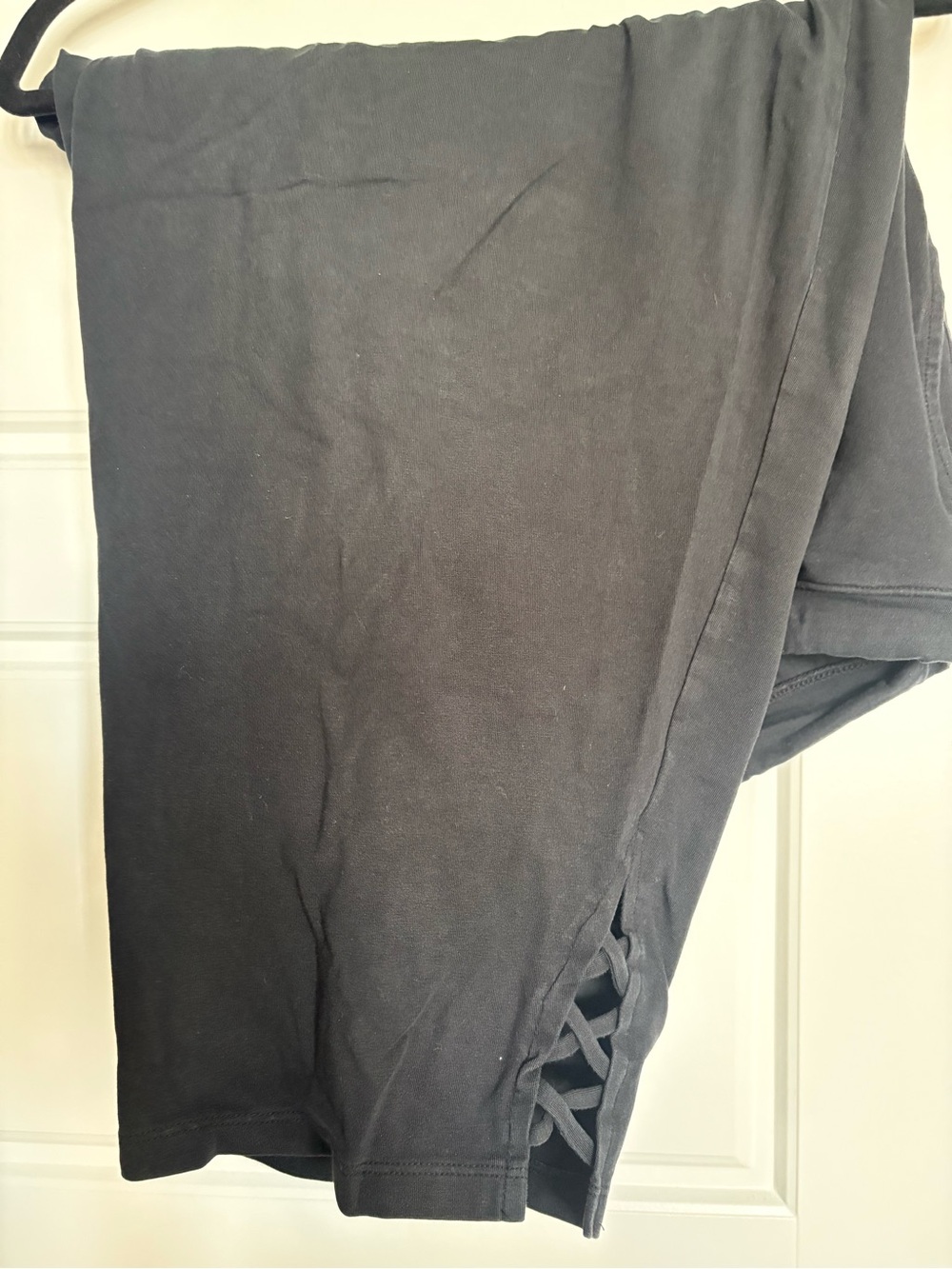 Catherine’s black Suprema capris with crisscross hem.